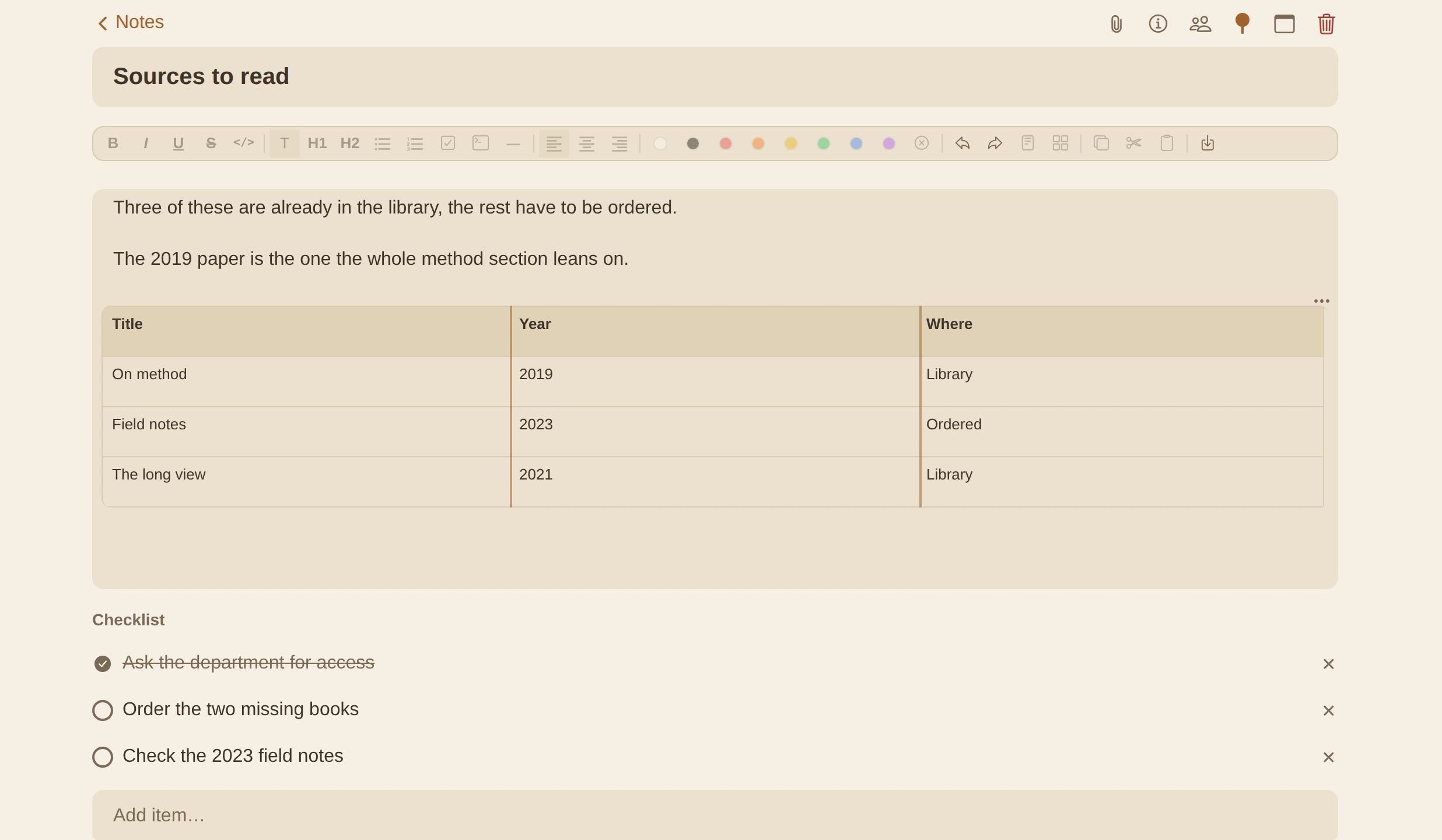 A note open in Idus, with the editing bar, a checklist and a real table.